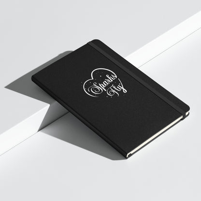 Black hardcover Sparks Fly Heart notebook.